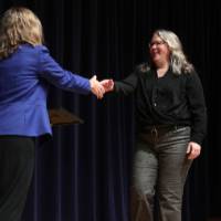 erica shaking hands at stage